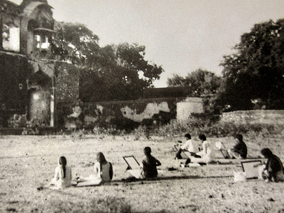 Old photograph of a painting class in progress near a stepwell entrance in Bundi, Rajasthan